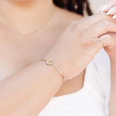 The Forget-Me-Knot Cuff is a simple handmade cuff that features a high-polish finish and time-honored knot detail that makes a greater statement piece. The adjustable cuff is made to go with any look and each knot is unique and carefully handmade by our artisan survivors. We love pairing this cuff with the knot studs, necklace, and knot ring. This best selling cuff is part of the “Hope Line” which consists of introductory pieces made by our new artisans, and it tells a powerful story of fresh be Elegant Adjustable Cuff Bracelet For Friendship, Adjustable Bangle With A Modern Twist For Gifts, Adjustable Bangle With A Modern Twist As A Gift, Modern Twist Adjustable Bangle As A Gift, Modern Twist Bangle As Gift, Adjustable Modern Twist Bangle, Holistic Care, Knot Studs, Knot Ring