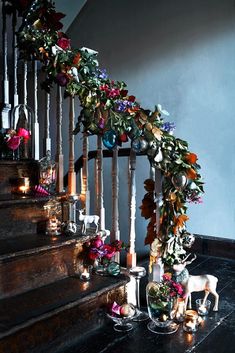 the stairs are decorated with flowers and candles