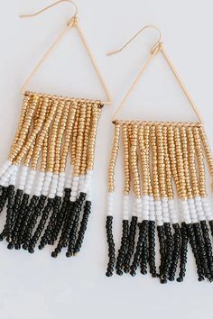 Super fun beaded earrings. Perfect way to spice up your look. Trendy White Dangling Bead Earrings, Trendy White Dangling Beads Earrings, Trendy White Earrings With Dangling Beads, Chic Beaded Earrings For Party, Trendy Beaded Dangle Earrings With Ear Wire, Beaded Drop Earrings For Party, Trendy Dangle Beaded Earrings With Ear Wire, Trendy Tassel Earrings With Dangling Beads For Party, Party Beaded Drop Earrings With Ear Wire