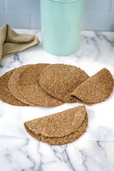 some kind of cracker on a table next to a potted plant