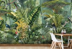 a wall mural with tropical plants and birds in the jungle, on top of a wooden table