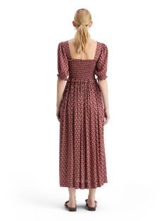 Unleash your inner bohemian goddess with our Smocked Maxi Dress. Made from 100% Modal, this dress offers a luxe feel and flattering silhouette. Perfect for a beach day or a summer festival, the flowy design and smocked detailing create a whimsical and free-spirited look. Pair it with sandals and layered jewelry for a laid-back vibe. 100% Modal Wash - 30 Degrees Delicate Bohemian Maxi Dress For Garden Party With Smocked Back, Flowy Midi Dress With Square Neck For Vacation, Flowy Square Neck Midi Dress For Vacation, Beach Maxi Dress With Smocked Bodice And Flowy Skirt, Ruched Smocked Maxi Dress For Beach, Ruched Smocked Maxi Dress For The Beach, Bohemian Ruched Maxi Dress For Garden Party, Beach Midi Dress With Smocked Bodice In Rayon, Maxi Smocked Dress For Beach