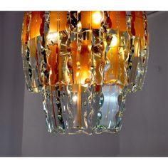 a glass chandelier hanging from the ceiling