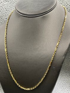 "Designed, manufactured and imported from Italy, this fabulous chain is made from 14 karat solid yellow gold. The combination of the Figero link and the solid diamond cut rope has always been a popular chain.  Strong and heavy in gold, this chain is perfect to wear everyday!   Woman or man, it looks great on! Weight-13.3 grams Length-20\" Thickness-2.8mm .   Our Price $1449.00 Regularly Priced At $2100.00 Please See Our Video Remember - If you're purchasing for yourself or a gift for a loved one, buy with confidence.  We Guarantee Everything We Sell!  SKU # C249" Elegant Yellow Gold Rope Chain Necklace With Curb Detail, Elegant Yellow Gold Curb Chain Necklace, Formal Gold Rope Chain Link Necklace, Formal Rope Chain Necklace, 14k Gold Link Rope Chain Necklace, Elegant Gold Diamond-cut Rope Chain Necklace, 14k Gold Rope Chain Necklace With Curb Chain, Elegant Gold Diamond Cut Rope Chain Necklace, 14k Yellow Gold Curb Chain Rope Necklace