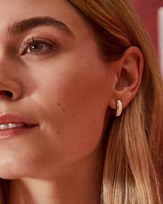 Amp up your earring game with the Kendra Scott Ainsley Gold Huggie Earrings in White Enamel. The minimal huggie style goes bold with hand-painted enamel embellishments, and the sides feature our signature hoofprint detailing for added texture. Lightweight enough for all-day wear, this pair will take any look from everyday to occasion ready. Metal 14k Yellow Gold Over BrassMaterial White EnamelClosure Ear PostSize 0.59"L X 0.56"W Station Due to the one-of-a-kind nature of the medium, exact colors Hoof Print, Concert Wear, Gold Huggie Earrings, Huggie Earrings Gold, Self Tanners, Kendra Scott Earrings, Golden Earrings, Beauty Sale, Huggie Earrings