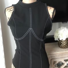 Sexy Black Fashion Nova Bodysuit Black Sleeveless Bodycon Bodysuit, Black Sleeveless Bodycon Top, Black Bodycon Top For Club, Fitted Bodysuit With Lined Body For Night Out, Fitted Sleeveless Bodysuit For Night Out, Edgy Fitted Bodysuit For Club, Edgy Black Bodysuit For Club, Black Sleeveless Bodysuit For Club, Sleeveless Black Bodysuit For Club