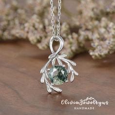 Moss Agate Leaf Pendant Necklace Women Olive Branch Necklace Nature Inspired Silver White Gold Chain Solitaire Cluster Necklace Dainty Gift ▶Pendant Details: ※Metal: 10K or 14K or 18K Solid Gold (Rose, White, or Yellow) , Silver ※Nature Moss Agate, Round Cut, 7mm ※Change Stones / Upgrade Stone Size, feel free to contact me! ※We can custom-make a Solid Gold Chain My Etsy shop: https://www.etsy.com/shop/oliviajewelryus ▶Tips: ※Accept return and exchange for normal orders. All returns are now eligible for a full refund! ※ Ring Size: All ring sizes are available, please contact me ※Material: As for material options - 14KW means 14k White Gold, and 14KY means Yellow Gold, 14KR means rose gold, YG Plated means Yellow Gold Plated, RG Plated means Rose Gold Plated, WG Plated means White Gold Plate Necklaces For Nature, Luxury Nature-inspired Silver Jewelry, Cheap Nature-inspired Silver Jewelry, Luxury Nature-inspired Necklace For Gift, Luxury Silver Nature-inspired Jewelry, Luxury Teardrop Nature-inspired Necklaces, Necklace Moss Agate, Nature Inspired Jewelry Agate, Luxury White Nature-inspired Necklaces