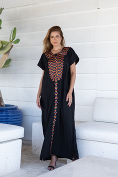 A bohemian flash caftan made of light mesh of linen and poly, the fabric is unique in that it's very flowy and not the usual feel and touch of linen. This Kaftan is ideal to wear for any casual occasion. Whether taking a trip down the shopping lane, or home-based kitty parties, or about anything else, wearing this dress will make you feel classy and comfortable. Fabric : 50% Linen, 50% Polyester. Please note that the fabric on this Kaftan has some weight to it and is meant to give off that crumb Traditional Maxi Dress With Multicolor Embroidery, Traditional Multicolor Embroidered Maxi Dress, Long Black Abaya For Vacation, Black Abaya For Beach, Black Abaya With Floral Embroidery, Black Bohemian Abaya For Beach, Black Tunic Abaya For Summer, Summer Black Tunic Abaya, Black Maxi Length Abaya For Beach