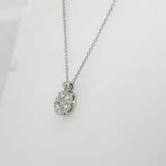 A fine Italian gold & diamond necklace.  In 14k white gold.  Prong set with 7 round brilliant cut diamonds in a stylized floral form.  (Overall ca. 3/4 total carat weight; Color range: G-H; Clarity range: VS-SI)  Accompanied by a GEMLAB (Gemological Appraisal Laboratory) report.  Simply a wonderful diamond pendant for any occasion!  Date: 20th Century  Overall Condition: It is in overall good, as-pictured, used estate condition with some fine & light surface scratches and other signs of expected Elegant Oval Pendant Diamond Necklace With Single Cut Diamonds, Exquisite Diamond Round Pendant Necklace, Diamond White Oval Pendant Diamond Necklace For Wedding, Formal Oval Pendant Diamond Necklace With Single Cut Diamonds, Exquisite Round Diamond Pendant Necklace, Exquisite Diamond Necklace With Round Pendant, Diamond White Oval Pendant Necklace For Wedding, Oval Pendant Diamond White Necklace For Wedding, Formal Diamond Necklace With Oval Pendant