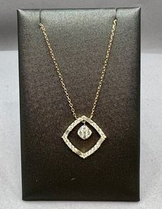 This diamond pendant is made up of baguette and round brilliant cut diamonds. The total diamond weight is 0.43 carats. The pendant is cast and assembled in 14kt Yellow Gold and is on a 14kt Yellow Gold chain with 2 stations that make the length adjustable. The pendant measures 15mmx15mmItem Number 160-00060 Luxury Brilliant Cut Diamond Necklace With Square Pendant, Luxury Wedding Diamond Necklace With Square Pendant, Luxury Single Diamond Square Pendant Necklace, Luxury Square Pendant Diamond Necklace For Wedding, Luxury Diamond Necklace With Square Brilliant Cut Pendant, Luxury Square Pendant Diamond Necklace With Prong Setting, Luxury Elegant Diamond Necklace With Square Pendant, Luxury Single Diamond Square Pendant Jewelry, Luxury Brilliant Cut Square Pendant Necklace