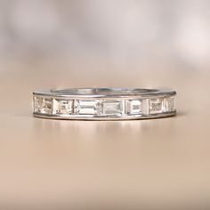 A beautiful wedding band, made from handcrafted platinum and channel set with baguette cut diamonds. The wedding band is currently a size 6, but our jewelers can custom make this same ring in any other ring size. The total approximate weight of the diamonds are 2.50ct. ✦ WHAT COMES IN YOUR SHIPMENT: - Your Engagement Ring - Quality Ring Box - Jewelry Cleaner - UGL Certificate ✦ WHY SHOP WITH US: - We've been in business for 40+ years - All of our rings are handcrafted and include high-quality na Beautiful Wedding Bands, Baguette Cut Diamond, Box Jewelry, Diamond Wedding Band, Channel Set, Baguette Cut, Jewelry Cleaner, Italian Charm Bracelet, Ring Box