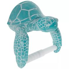 a green sea turtle on top of a roll of toilet paper with its mouth open