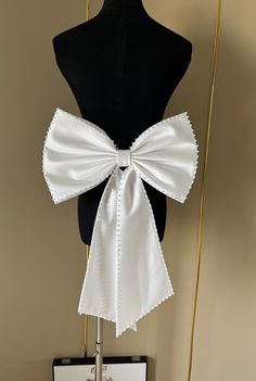 Friends, welcome to my store. https://www.etsy.com/uk/listing/1601619992/additional-fees If you are unsure of the colour, please purchase a colour sample to match.             Our bows are unique and can be paired with belts. This gives you a variety of options for pairing, click this link to purchase your belt. https://www.etsy.com/uk/listing/1684345476/romantic-strappy-belts-in-various-colors Our wedding bows can be customized according to your needs, you can provide the size and different col Elegant Bridal Belt With Satin Bow For Party, White Bridal Accessories With Satin Bow For Party, White Ribbon Bridal Belt For Party, Elegant Wedding Sashes With Decorative Bow, Satin Bow Tie For Wedding, White Ribbon Bow Tie For Party, White Satin Bow Tie For Wedding, White Detachable Bow Tie For Wedding, White Bow Tie With Detachable Bow For Wedding