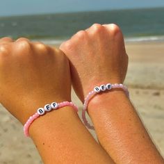 Matching bff bracelets for you and your best friend!! Cheap White Bracelets For Best Friend, Personalized Purple Wristband For Friendship, Pink Bracelet Wristband For Birthday, Pink Wristband For Birthday, Adjustable Pink Friendship Bracelets, Purple Friendship Bracelets With Letter Beads, Trendy Blue Jewelry For Best Friend, Pink Letter Beads Name Bracelet, Casual Multicolor Jewelry For Best Friend Gift