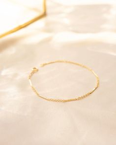 Delicate chain bracelet, Minimalist style chain, Gold filled bracelet, Gold dainty bracelet, Gold bracelet, Dainty minimalist bracelet --- Be ultra minimalist in our Capri Bracelet. The sleek flat link design pairs perfect with your other favorite FFD bracelets. Check out our Capri Necklace and Anklet for for the full set.  Details: -Gold Filled, Sterling Silver -Waterproof, Tarnish Resistant, Hypoallergenic  -Length 7" Minimalist 14k Gold Filled Bracelet With Adjustable Chain, Minimalist Hypoallergenic 14k Gold-filled Bracelets, Minimalist Hypoallergenic 14k Gold Filled Bracelets, Dainty Everyday Chain Bracelet, Adjustable Minimalist Gold Bracelet With Satellite Chain, Minimalist Adjustable Gold Bracelet With Delicate Chain, Simple Adjustable Gold Bracelet With Delicate Chain, Minimalist Satellite Chain Bracelet As Gift, Minimalist Satellite Chain Bracelet Gift