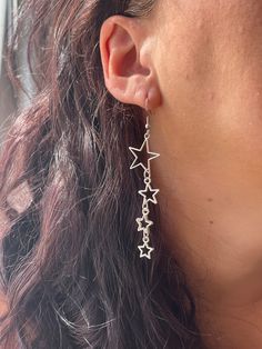 "Star Earring, Hippie Earring Star Hoop Earring Our simple, affordable silver star earrings are the perfect accessory for any outfit. Add a little edge to your look! These earrings are great for casual wear or for dressing up your makeup on the weekend. Pair them with any outfit from jeans to a cocktail dress. They're cute, dainty and easy to wear - just add these to your cart today! Lever back to secure, these 'huggie' earrings are the perfect gift for someone or for yourself!  This listing is for one (1) pair of Star Hoop Earrings.  The length of the earrings is about 3.23\" but may vary with the personalization options~ Style:  ~ Regular Huggies: as pictured, silver plated ~ Sterling Silver: made to order, with 925 sterling silver hooks & hypoallergenic  ~ Stainless Steel: made to order Star Earrings Silver, Star Hoop Earrings, Star Outline, Silver Star Earrings, Minimalist Earring, Hippie Earrings, Tourmaline Necklace, Earrings Minimalist, Jewelry Earrings Hoops