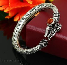 Amazing handcrafted unique designer work 925 sterling silver vintage design custom made oxidized silver personalized unisex gifting jewelry from India. Metal-925 sterling silver. Item type-Bangle /bracelet/ Kada. Weight-43.560 grams. Size-2-6 (2.375 inches inner diameter)We can easily adjust by twisting it for bigger size. Width-1.0 centimeters stamped- 925. Finish-Oxidized. Makes excellent gifting for birthday, mother's day, father's day, Christmas day,valentinesday, wedding, anniversary gifts Traditional Sterling Silver Bangle With Polished Finish, Silver Openable Temple Jewelry, Temple Jewelry Bangle With Oxidized Finish As Gift, Sterling Silver Bangle For Ceremonial Festivals, Adjustable Silver Jewelry For Puja, Sterling Silver Bangle For Rituals And Festivals, Handmade Silver Bangle For Diwali, Silver Bracelet Jewelry For Diwali, Adjustable Sterling Silver Bracelets For Diwali