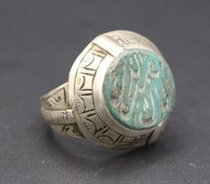 Afghan Turkmen traditional silver mughal hand made ring. Beautiful Arabic scripture, compressed Malachite stones and partial gold wash. Please do not hesitate to contact if you have any questions about items or further information. Measures :  Size of the ring : 8 US Jewelry Ring Mandrel, Weight : 7.4 Grams, Shipping & Estimated Delivery Time With Turkish Registered Post, Destination CountryStandard Shipping (business days) United States          15-20  Europe7-15 Asia15-25  Australia15-20 Brazi Traditional Carved Rings For Ceremonial Occasions, Traditional Carved Ceremonial Rings, Traditional Silver Signet Ring For Ceremonial Use, Traditional Silver Turquoise Ring, Traditional Silver Turquoise Ring With Inlay, Traditional Green Sterling Silver Rings, Traditional Sterling Silver Rings With Inlay, Traditional Silver Engraved Ring, Traditional Handmade Signet Ring For Ceremonial Use