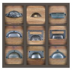 several different types of door knobs on a wooden surface