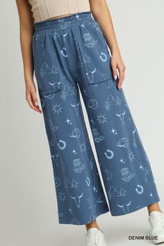 our french terry wide leg elastic waistband pants with graphic print & side pockets! who says style and comfort can't coexist? get ready to kick back and relax in these wide leg pants, complete with an elastic waistband (for indulging in all the snacks). plus, with a graphic print and handy side pockets, you'll be looking and feeling like a fashionista.shop our matching set, french terry graphic printed top!fabric contents & fit notes:• model is 5'9" and is wearing a small.• all measurements are Trendy Cotton Bottoms With Elastic Waistband, Trendy Cotton Bottoms For Loungewear, Trendy Cotton Loungewear Bottoms, Cotton Wide Leg Pants With Graphic Print, Wide Leg Cotton Pants With Graphic Print, Trendy Cotton Bottoms With Comfort Waistband, Trendy Cotton Lounge Pants, Trendy Cotton Wide Leg Pants With Elastic Waistband, Printed Blue Bottoms For Loungewear