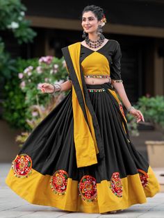 Elevate your traditional attire with this stunning black & yellow gamthi work cotton Navratri lehenga choli. This fully stitched ensemble features intricate gamthi and mirror work on the lehenga, colorful cowrie lace touch-up on the choli, and gamthi work on the plain dupatta with a lace border. The vibrant colors and traditional designs make it the perfect outfit for the Navratri festival.
This gorgeous lehenga choli includes a 5-meter flair for graceful movement, a lehenga length of 42 inc Gamthi Work, Navratri Lehenga, Lehenga Crop Top, Mirror Work Lehenga, Cotton Lehenga, Lehenga Choli Wedding, Floral Lehenga, Navratri Chaniya Choli, Party Wear Lehenga Choli