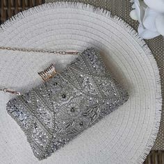 Captivating, Elegant, and Wedding-Ready – The Luxe Silver Wedding Clutch Bag is a showstopping accessory designed to elevate your bridal gown or wedding guest dress with whimsical beaded elegance. Featuring intricate silver beading and shimmering sequins, this silver wedding clutch bag exudes timeless sophistication and glamour for your most special occasions. Why We Love It...We adore the dazzling silver bead and sequin design that beautifully catches the light, adding a touch of opulence to an Glamorous Rectangular Sequined Evening Bag, Elegant Rectangular Sequin Clutch, Rectangular Sequined Party Clutch, Rectangular Sequin Party Clutch, Silver Glamorous Evening Bag For Party, Elegant Rectangular Evening Bag With Sequins, Luxury Sequined Rectangular Evening Bag, Elegant Evening Bag With Bling For Parties, Elegant Bling Evening Bag For Parties