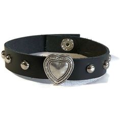 "Soft Studded Black Flower Leather Bracelet - Silver Round Studs - 10mm Black Leather Wristband This black leather wristband is 10mm wide and about 8 inches long. It can fit a wrist 7.5\" around. The strap is made of handcut soft cowhide Genuine leather. It have added a silver heart slide charm in the center with 5 mm Silver Round Studs evenly spaced on both sides. I have added a silver snap button closure on the ends. I have worn it myself and get many compliments on it. The silver flower seems Edgy Black Leather Bracelet With Studs, Black Adjustable Studded Wristband, Punk Leather Bracelet With Studs, Black Gothic Leather Bracelet With Studs, Gothic Black Studded Leather Bracelet, Three Necklaces, Leather Wristbands, Funky Jewelry, Heart Bracelet