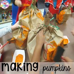 some kids are making pumpkins out of paper bags with orange paint on them and the words, making pumpkins