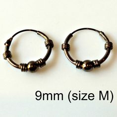 These mesh wire earring hoops are made from sterling silver and plated with black gold. Other wire hoops design available. Please browse through the link below. SPECIFICATION Base metalRecyclable fine 925 Sterling Silver Outer LayerPlated with Black Gold Inner Diameter9 mm (Size M) Available in 2 colors: Black Gold Plating Rose Gold Plating ▶ Shipping, Custom Orders, and Return Policy We use 3-day USPS delivery service and often get praise for our fast shipment and professional packing. Full ref Boyfriend Stuff, Wire Hoop Earrings, Mens Earrings Hoop, Stud Earrings For Men, Jewelry Board, Men Earrings, Earrings Black, Small Earrings, Cartilage Earrings