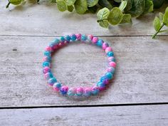 Handmade!! This bracelet is handmade with 6mm blue & pink crackle beads!  The bracelets are easy to get on and off with the stretch elastic, and would look great on their own or stacked with another bracelet! Size - 7in (average woman's size) *all bracelets are double strung for extra durability Minimalist Colorful, Colorful Bracelet, Handmade Jewlery, Bracelet Minimalist, Beads Bracelets, Stackable Bracelets, Zipped Bag, Measuring Tape, Handmade Bracelet