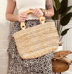 "Beachy wicker woven handbag with wooden handles. Medium in size. Great for a day on the beach or even a night out.  Zipper enclose, with small pocket inside. 100% made of natural cornhusk material. Dimensions: 16\" x 10\"x 1\"" Summer Style Rectangular Straw Bag With Detachable Handle, Vacation Straw Tote Bag With Detachable Handle, Vacation Tote Straw Bag With Detachable Handle, Rectangular Straw Bag With Leather Handles For Day Out, Beach Straw Tote Bag With Detachable Handle, Beach Tote Straw Bag With Detachable Handle, Casual Straw Bag With Detachable Handle For Beach, Casual Beach Bag With Detachable Handle In Natural Color, Rectangular Straw Bag With Braided Handles For Day Out