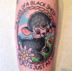 a tattoo on the leg of a person with a black sheep and flowers around it