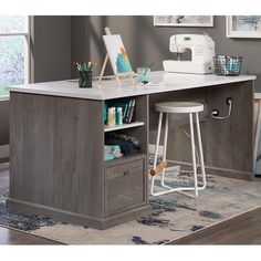 a sewing machine sitting on top of a wooden desk next to a white countertop