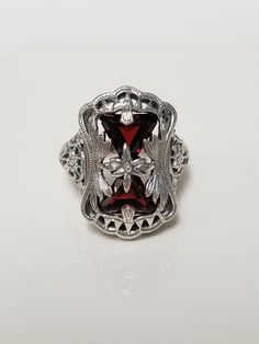 "Thanks for shopping our vintage estate store. We tend to sell well below wholesale and truly hope you enjoy all of our items. Many of the items are one of a kind, so please enjoy scrolling through the pictures and hopefully something will catch your eye. Estate sterling silver 925 natural 1ct garnet trillion cut filigree ring. Beautiful ring, one that was custom made in our shop, meaning we set the gems into the setting. Love this victorian style ring. Ring size: please select Setting: 5/8\" by 3/4\" 9mm Band width: 1.5mm Weight: 6.22 grams Beautiful ring one that you will love. Gems testing natural, but maybe created." Vintage Gothic Wedding Rings, Classic Jewelry For Valentine's Day, Estate Style Collectible Gemstone Jewelry, Vintage Hallmarked Rings For Formal Occasions, Vintage Sterling Silver Jewelry For Anniversary, Classic Silver Ruby Ring For Valentine's Day, Vintage Rings With Hallmark As Gift, Estate Style Round Jewelry Gift, Vintage Formal Birthstone Jewelry