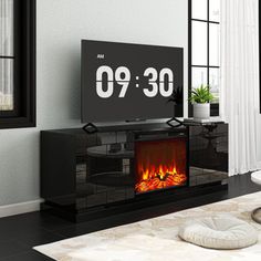 a living room with a fire place in the center and a large clock on the wall