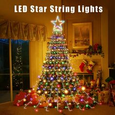 a christmas tree with lights on it in front of a window and the words, led star string lights