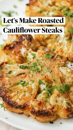 roasted cauliflower steaks on a plate with parsley sprinkled on top