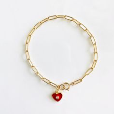 Loving these new heart charm bracelets. Something about them reminds me of the playfulness of childhood, but with an updated elegant (and adult) twist. These enamel charms are available in red, light pink, white, and black, and are all accented with a cubic zirconia. Charm also available in a cubic zirconia heart. If you like the looks of how some are styled in the pictures with multiple charms, please contact me for a customizable bracelet. Otherwise, each bracelet comes with 1 charm. Charms ar Valentine's Day Gift Chain Bracelet With Lobster Clasp, Handmade Red Chain Bracelet Gift, Handmade Red Chain Bracelet As Gift, Handmade Red Chain Bracelet For Gift, Adjustable Heart-shaped Charm Bracelet With Heart Charm, Adjustable Red Heart Charm Bracelet, Friendship Bracelets With Double Heart Charm, Valentine's Day Gift Bracelets With Lobster Clasp, Valentine's Day Gift Bracelet With Lobster Clasp