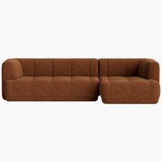 a brown couch sitting on top of a white floor