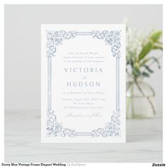 a wedding card with the word victoria hudson in blue on it and flowers behind it