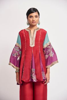 Auburn red applique embellished habutai silk short godet kurta, wide leg pants & teal dupatta. From Aisha Rao's Kinfolk collection. DELIVERY TIMEPlease allow 6-8 weeks for your outfit to arrive. FABRIC DETAILSSilk Professional cleaning only. Auburn Red, Nyc Studio, Sequin Appliques, Kurta With Pants, Silk Shorts, Kurta Set, Bride Bridal, Flared Sleeves, Aza Fashion