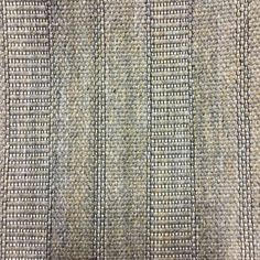 an upholstered fabric textured with small squares