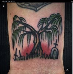 a palm tree tattoo on the ankle