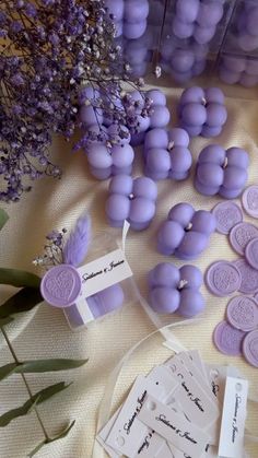 some purple buttons and tags on a table