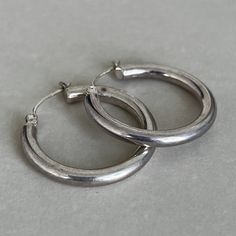 Vintage sterling silver earrings  mark- 925 CI condition- vintage, patina, please look at pictures measures approximate- 26mm diameter  weight- 4.6 grams  J260 Silver Earrings Aesthetic Vintage, Vintage Nickel-free Earrings For Everyday, Everyday Vintage Round Earrings, Vintage Nickel-free Small Hoop Earrings, Silver Hallmarked Minimalist Earrings, Vintage Sterling Silver Round Earrings, Classic Hoop Earrings Stamped 925 For Anniversary, Silver Minimalist Hallmarked Earrings, Classic 925 Stamped Hoop Earrings For Anniversary