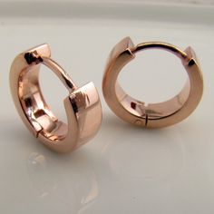 These rose gold plated men's hoop earrings are made from sterling silver. These men's hoop earrings are size M and 3mm wide. Our medium sized men's hoop will leave a small gap between the hoop and earlobe for most people. Sold as a single earring or as a pair. SPECIFICATION Base metal: Recyclable fine 925 Sterling Silver Outer layer: 18K rose gold, thick coating Outer Diameter: 12mm (medium hoop size) Inner Diameter: 8mm Width: 3mm Ear post gauge: 20G, standard Other sizes Large hoops https://ww Classic Rose Gold Small Hoop Huggie Earrings, Classic Small Hoop Rose Gold Huggie Earrings, Rose Gold Polished Sterling Silver Hoop Earrings, Rose Gold Polished Hoop Earrings As Gift, Rose Gold Sterling Silver Hoop Earrings With Polished Finish, Rose Gold Polished Finish Hoop Earrings As Gift, Modern Small Hoop Huggie Earrings In Rose Gold, Minimalist Rose Gold Hoop Earrings With Polished Finish, Modern Rose Gold Hoop Huggie Earrings