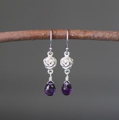 "Sweet faceted Purple Amethyst teardrops are carefully wire wrapped with silver wire onto Bali Silver rose flower links. These dangle from balled silver earwires. Wear these lightweight petite everyday to work or with your favorite jeans. Perfect for girls and women of any age. Bali Silver rose link: 7x12mm Amethyst teardrops: 5x7mm Total length of earrings: 1 1/4\" All silver is sterling. As the owner, maker, designer, and curator of this shop, I take great pride in providing you with jewelry t Wire Wrapped Teardrop Earrings For Anniversary, Anniversary Teardrop Flower Earrings, Wire Wrapped Briolette Earrings For Anniversary, Elegant Adjustable Wire Wrapped Teardrop Earrings, Sterling Silver Teardrop Pierced Flower Earrings, Adjustable Teardrop Flower Earrings, Elegant Teardrop Silver Plated Wire Earrings, Sterling Silver Teardrop Flower Earrings, Wire Wrapped Flower Earrings As Gift