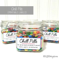 three glass jars filled with colorful candy beans