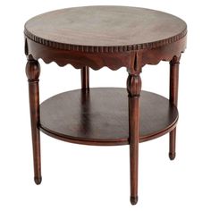 a round wooden table with two tiered shelves on one side and an open shelf on the other