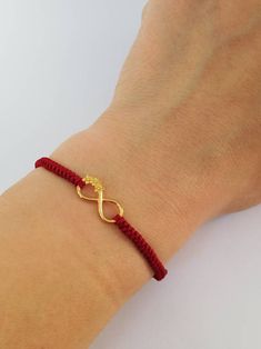 Lovely Gold plated Infinity flowers bracelet for women. Perfect anniversary present for wife. Sister Infinity present idea. Charm Infinity red string bracelet. Hand knitted protection red thread. Love you day gift. Handcrafted with gold plated over sterling silver 925 Infinity element and high quality hand knitted red thread Griffin. This pretty bracelet is 100% woterproff. Universal Adjustable size. Ready to ship in 1-3 business days. Visit our shop here https://etsy.me/2YxPw10 Visit our Facebo Elegant Adjustable Friendship Bracelets As Gift, Elegant Adjustable Cord Friendship Bracelets As Gifts, Elegant Macrame Bracelets As Gift, Macrame Bracelet Jewelry As Gift, Macrame Bracelet Jewelry Gift, Elegant Braided Bracelets With Adjustable Cord As Gift, Braided Friendship Bracelets For Valentine's Day, Handmade Infinity Bracelet As Gift, Handmade Infinity Bracelet Gift